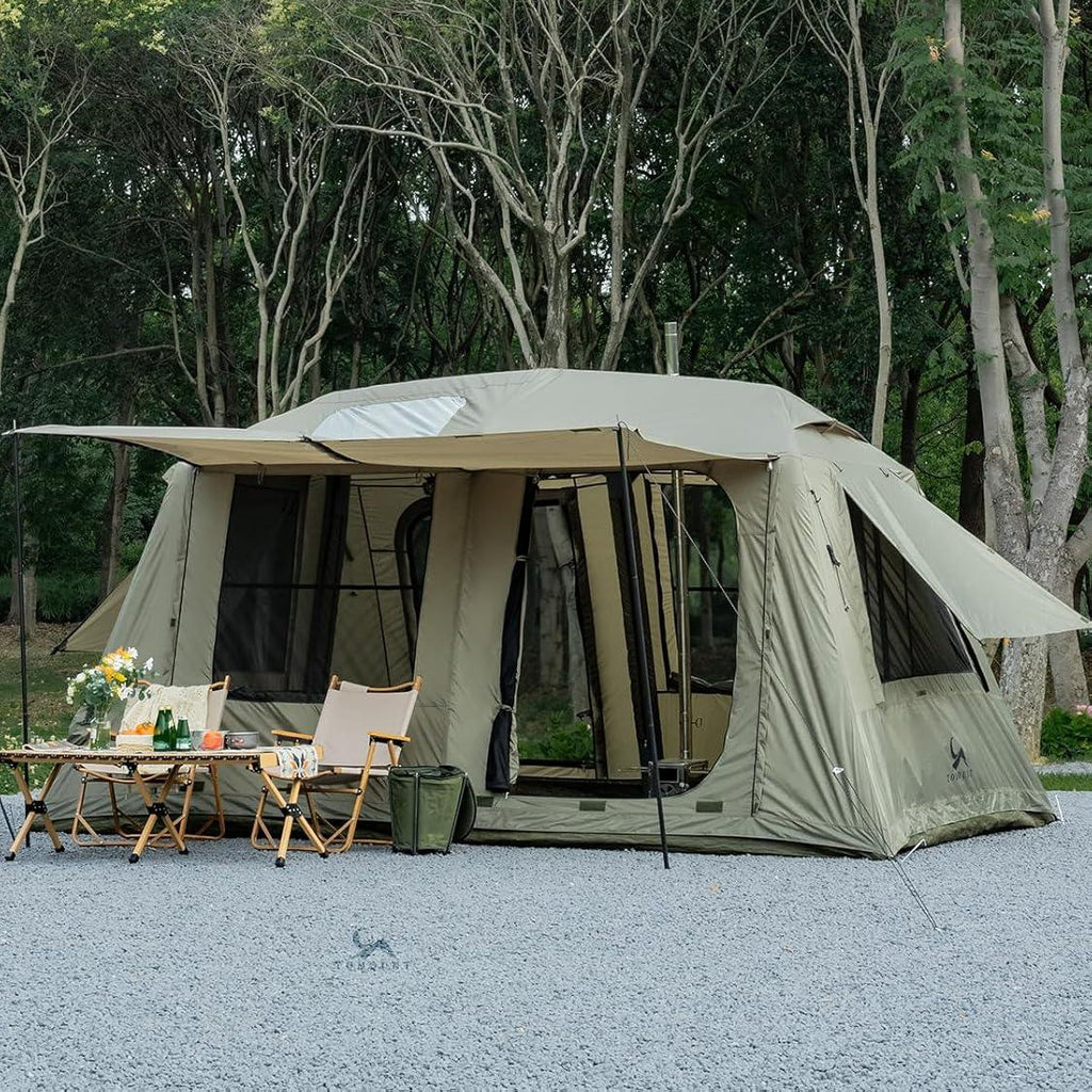 Spacious camping tent with large windows and doors set up outdoors with chairs and a table